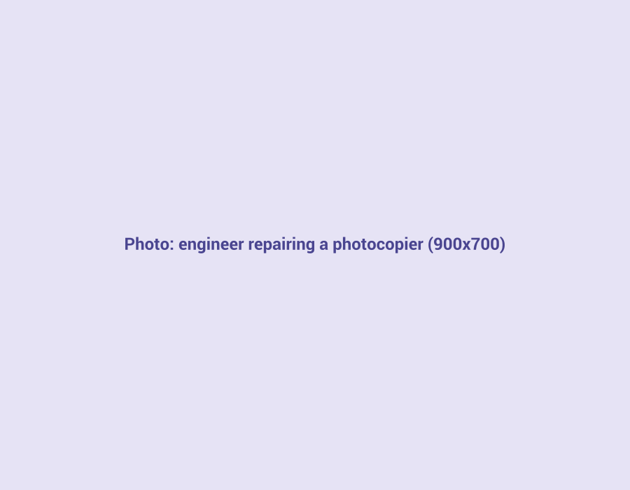 Engineer repairing a photocopier in Mumbai